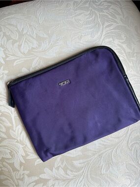 Tumi purple fabric toiletry amenity travel pouch designed for Delta Airlines